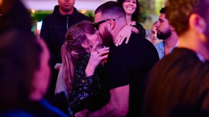 At Coachella, Travis Kelce dances amid the throng, wrapping his arms protectively around Taylor Swift.